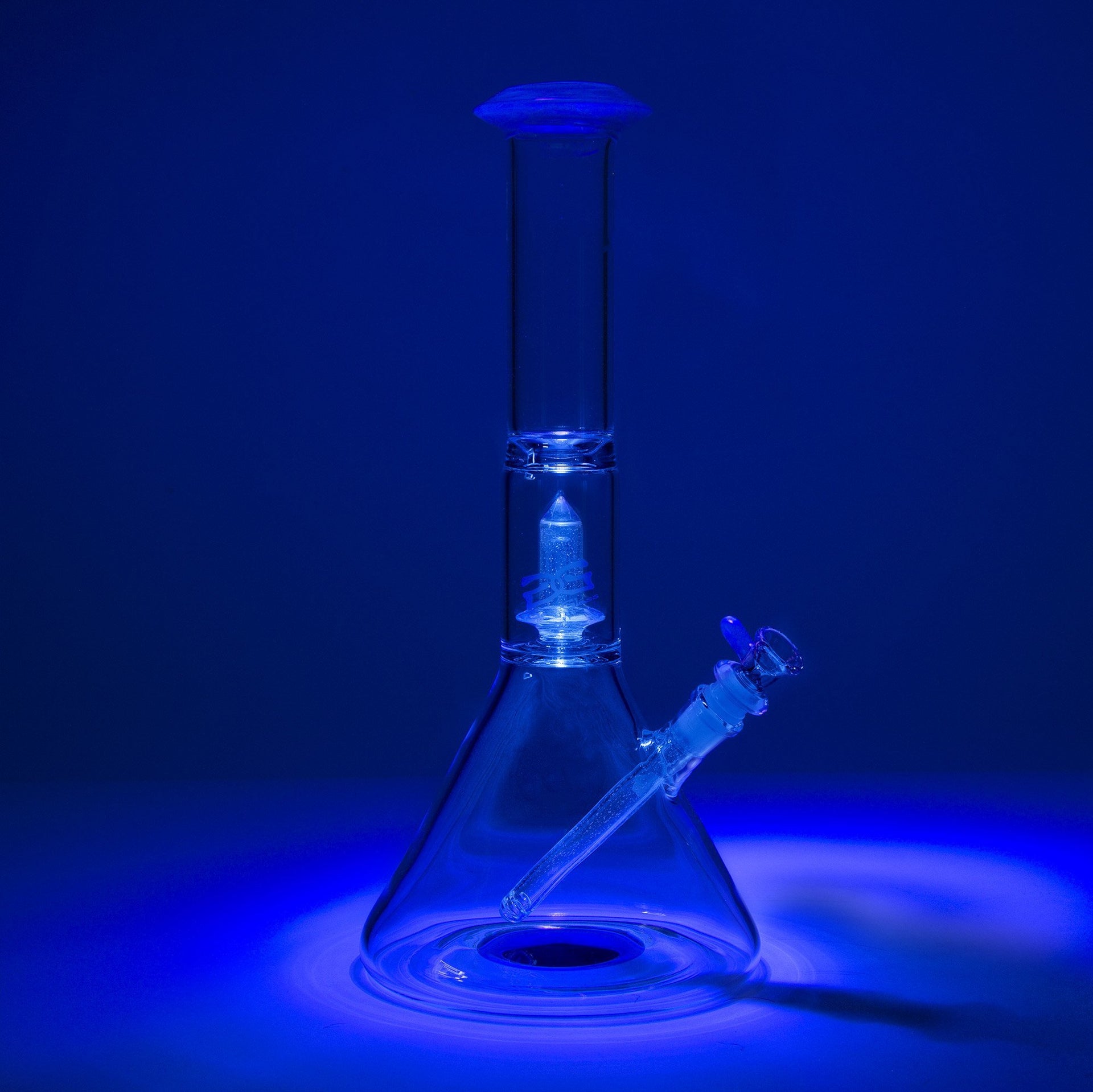 Geo's Glass 14in Crystal Circ Beaker Bong - Atomic Stardust + Blu-V UV Reactive - 420 Science - The most trusted online smoke shop.
